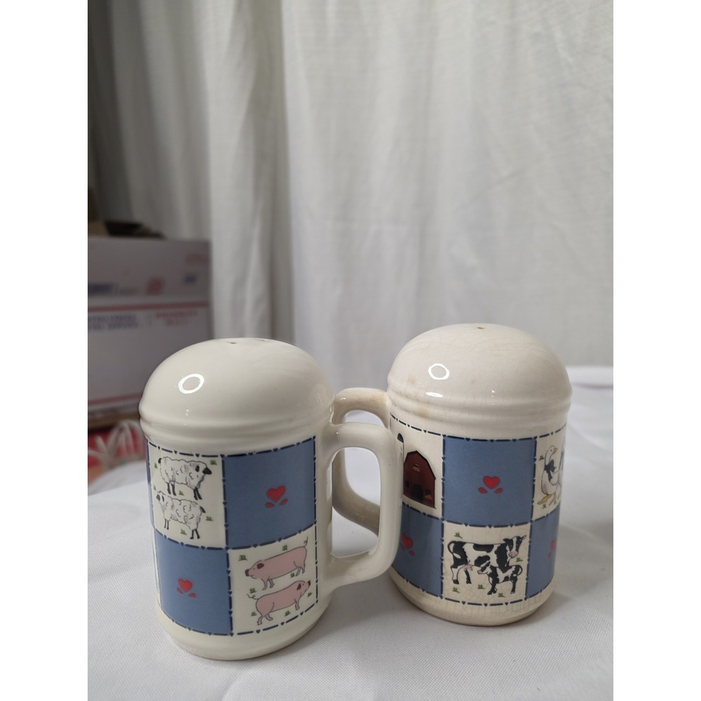 Checkerboard Farms ceramic salt and pepper shakers featuring a blue and white...